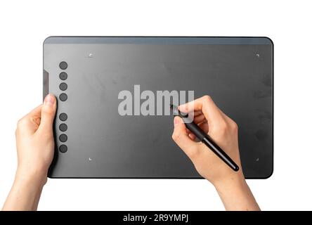 Hands holding drawing pad, drawing, signing with stylus isolated on white. Stock Photo