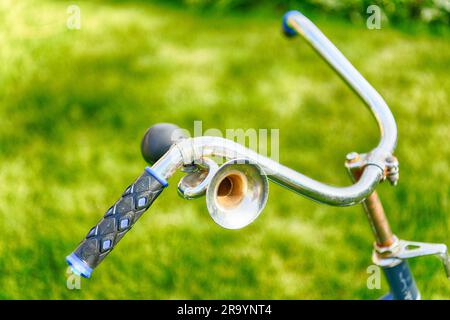 Vintage horn on handlebar of an old bicycle Stock Photo