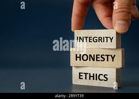 integrity honesty ethics, Ethics and honesty in life and business, hand arranging wooden blocks with the text " Integrity Honesty copy space, beautifu Stock Photo