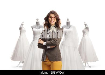 Bridal shop owner posing in front of gowns isolated on white background Stock Photo