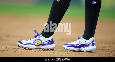 Colorado Rockies left fielder Jurickson Profar (29) wears a pair of Nike  cleats featuring the face of the team's mascot, Dinger the dinosaur, in the  ninth inning of a baseball game Tuesday