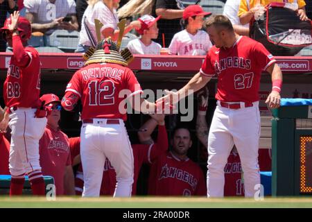 Los Angeles Angels' Hunter Renfroe (12) is greeted by Mike Trout