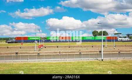 Stuw- en sluizencomplex Sambeek, Netherlands - July 9. 2023: Maas river sluis with inland waterway cargo container ship Stock Photo