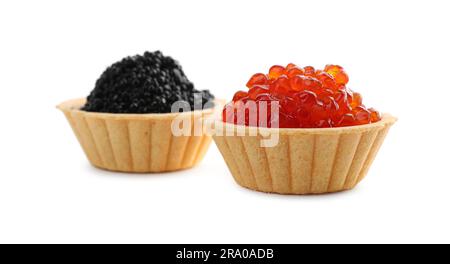 Delicious tartlets with red and black caviar on white background Stock Photo