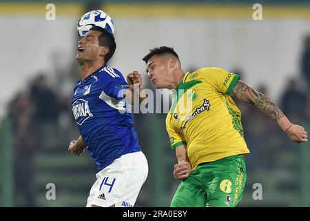 David Silva of Colombia's Millonarios, left, heads to score his side's  opening goal against Brazil's Atletico Mineiro during a Copa Libertadores  soccer match at El Campin stadium in Bogota, Colombia, Wednesday, March