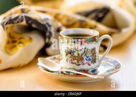 Time for a break. The Lady drinks a cup of warm and flavoured coffee Stock Photo