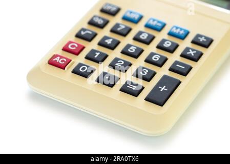Detail of an old home calculator isolated on white backghround Stock Photo