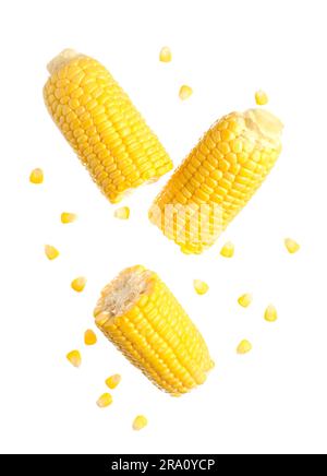 Cut fresh corn cobs and seeds on white background Stock Photo