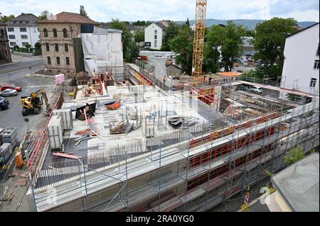 Kassel, Germany. 27th June, 2023. View of the construction site for the new building of the Wallpaper Museum, which will celebrate its groundbreaking on June 30, 2023. It is being built on Brüder-Grimm-Platz to mark the 100th anniversary of the German Wallpaper Museum Association. The gate guard can be seen in the background. Credit: Uwe Zucchi/dpa/Alamy Live News Stock Photo
