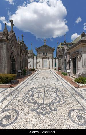 Artistic stone pavement calcada portugesa in the section of the religious order Ordem da Trindade, historical cemetery Cemiterio de Agramonte Stock Photo