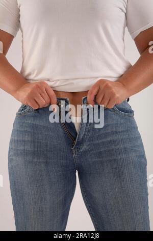 Too tight trousers Stock Photo - Alamy