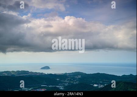 Fast moving clouds over the mountain tops. Jiufen at dusk. Ruifang District, New Taipei City, Taiwan Stock Photo