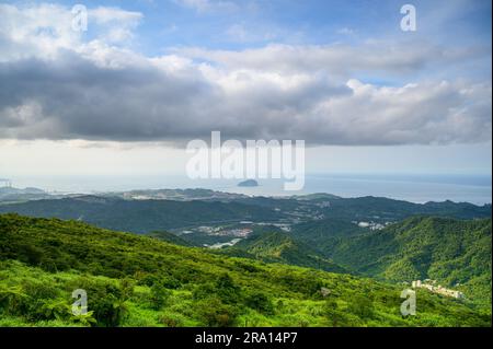 Fast moving clouds over the mountain tops. Jiufen at dusk. Ruifang District, New Taipei City, Taiwan Stock Photo
