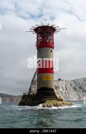 The Needles lighthouse on the Isle of Wight taken from close up passing by in a boat. Lighthouse and rock formations can be clearly seen. June 2023. Stock Photo