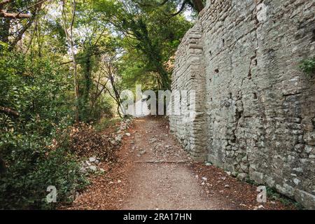 an ancient stone wall at Butrint Archaeological Park in Southern ...