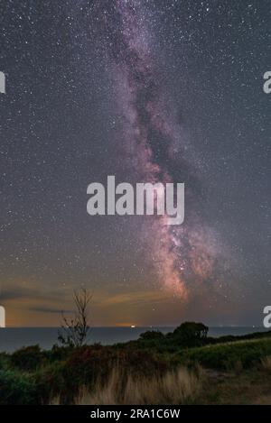 A breathtaking long exposure nighttime scene of the Milky Way and starry sky from Fairlight Stock Photo