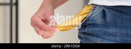 Man turning inside and showing empty pocket Stock Photo
