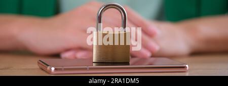 Closed metal lock on modern smartphone, mobile phone security Stock Photo