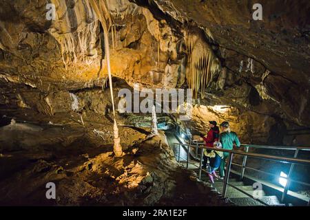 Tourists are walking in the Punkva (Punkevni) Caves decorated with stalactites and stalagmites in Moravian Karst, Czech Republic, June 29, 2023. (CTK Photo/Patrik Uhlir) Stock Photo