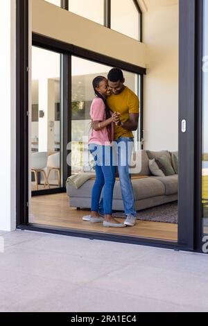 Happy african american couple dancing in living room Stock Photo