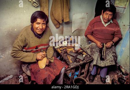 Peru, Portrait of shoemakers at work in their workshop. Stock Photo