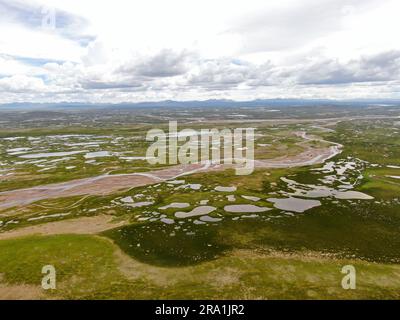 (230630) -- GOLMUD, June 30, 2023 (Xinhua) -- This aerial photo taken on July 23, 2021 shows a view of the Damqu River at the source region of the Yangtze River, China's longest river, in northwest China's Qinghai Province. The 6,300-kilometer Yangtze River, the longest river in China and the third longest in the world, has three sources, namely the Tuotuo River, the Damqu River in the south and the Qumar River in the north. Located in the hinterland of the Qinghai-Tibet Plateau between the Kunlun Mountains and the Tanggula Mountains, the Yangtze River source region, with an average elevat Stock Photo