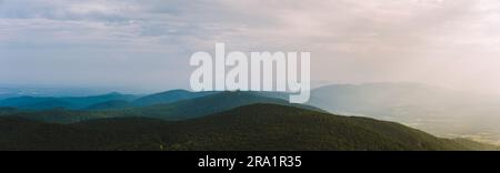 A panoramic view of a wide mountain range in Virginia with sun rays. Stock Photo