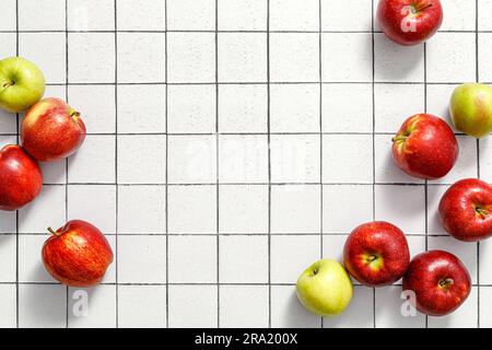 Apples. Fresh juicy red and green apple fruits on kitchen table, copy space, top view Stock Photo