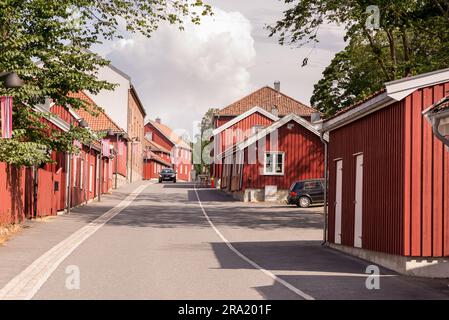 Street view in Moss, Norway with typical red scandinavian houses. Photographed on a sunny summer day. Stock Photo