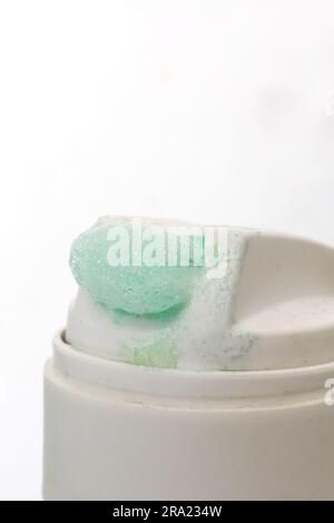 Green shaving foam with the can closeup, copy space Stock Photo