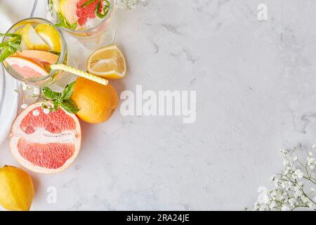 Top view of aesthetic summer cocktails with citrus fruits. Copy space. Vitaminized detox water. Low alcohol, zero proof drinks Stock Photo