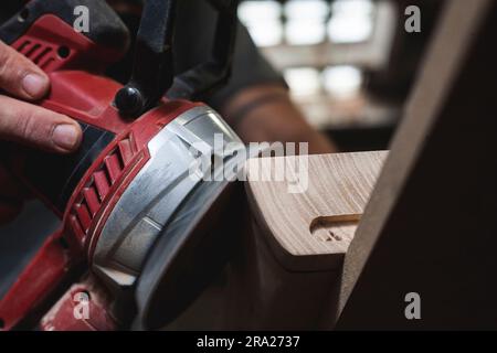 Close-up detail of a sander working on wood. Stock Photo