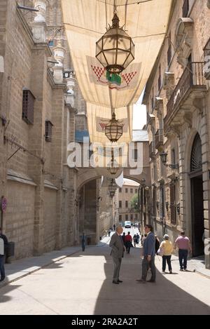 Toledo Spain, view of the Calle Arco de Palacio sited between the Cathedral ( L) and Archbishop's Palace (R) in the historic Old Town area of Toledo Stock Photo