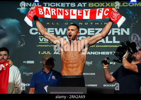 Boxer Callum Simpson holds up a Barnsley scarf during a weigh in at the AO Arena, Manchester. Picture date: Friday June 30, 2023. Stock Photo