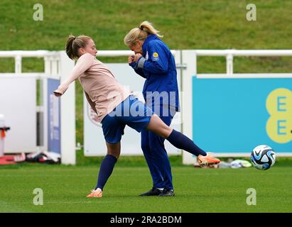 England's Keira Walsh kicks a ball away from manager Sarina Wiegman during a training session at St. George's Park, Burton-on-Trent. Picture date: Friday June 30, 2023. Stock Photo