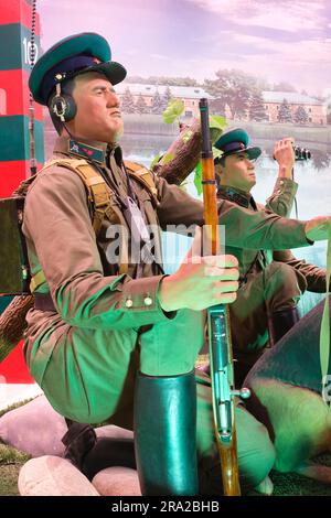 A diorama of a soldier listening to chatter and a soldier looking through binoculars. At the Shon Sharaf Great Patriotic War, WWII museum park complex Stock Photo