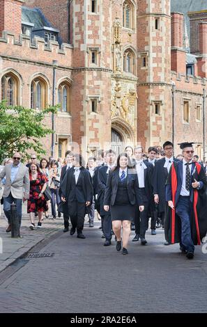 Led by staff, students from Magdalene College, University of Cambridge, England, process past St John's College to Senate House for their graduation award ceremony on Friday 30 June 2023. Stock Photo