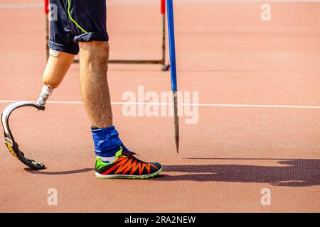 leg on prosthesis male athlete with spear at athletics championships, summer para sports games Stock Photo