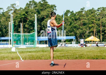 para athlete without leg with crutch javelin throw at athletics championships, summer sports games Stock Photo
