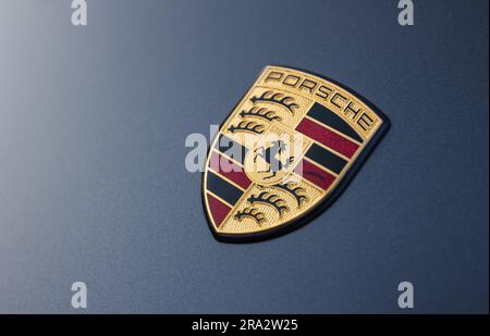 Berlin, Germany - June 24, 2023: German Porsche logo on a Porsche car hood. Porsche is a German automobile manufacturer specializing in high-performan Stock Photo