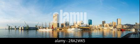 Panoramic view of the Harborland waterfront area of Kobe docks with the sailing ship, Nippon Maru and tourist ship, Concerto, and Mosaic shopping mall Stock Photo