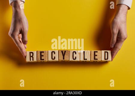 recycled word written on wood block. recycle text on cement table for your desing, concept Stock Photo