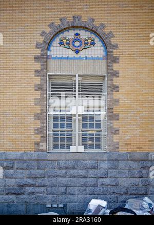 Newtown High School in Queens, NY, was built in stages: Flemish Revival main building and wings in 1921 and 1931; International Style wing in 1958. Stock Photo