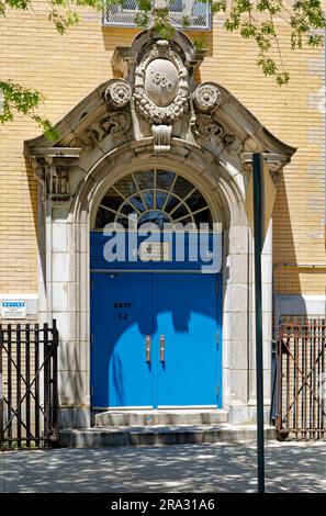 Newtown High School in Queens, NY, was built in stages: Flemish Revival main building and wings in 1921 and 1931; International Style wing in 1958. Stock Photo