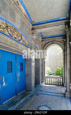 Newtown High School in Queens, NY, was built in stages: Flemish Revival main building and wings in 1921 and 1931; International Style wing in 1958. Stock Photo