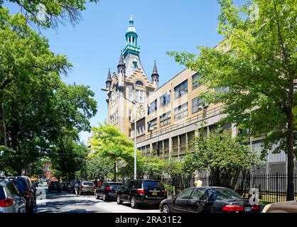 Newtown High School in Queens, NY, was built in stages: Flemish Revival main building and wings in 1921 and 1931; International Style wing in 1958. Stock Photo