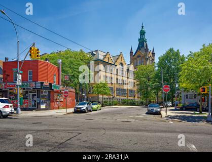 Newtown High School in Queens, NY, was built in stages: Flemish Revival main building and wings in 1921 and 1931; International Style wing in 1958. Stock Photo