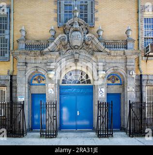 Newtown High School in Queens, NY, was built in stages: Flemish Revival main building and wings in 1921 and 1931; International Style wing in 1958. Stock Photo