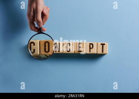 Realistic wooden blocks with concept word on blue table Stock Photo