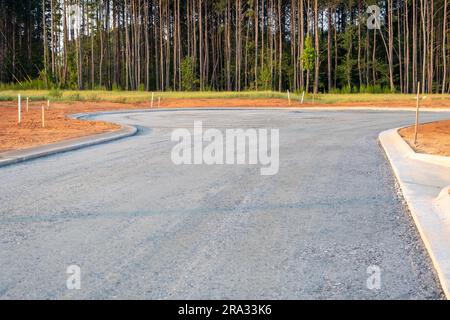 Flat road gravel subbase in new construction residential subdivision Stock Photo